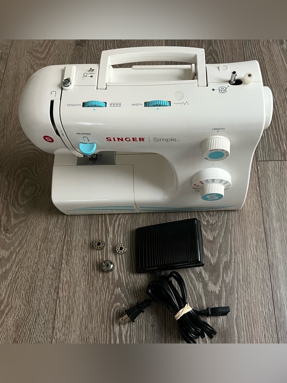 Singer Simple Compact Sewing Machine - White with Aqua Accents Conditions
